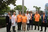 uci health leaders, physicians and community members wearing orange t-shirts gather in front of the flag pole at uci medical center in orange calif to recognize gun violence awareness day and wear orange weekend