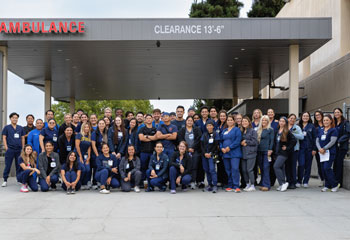 the uci health emergency department team poses for a group photo and celebrates receiving the 2025 lantern award from the emergency nurses association